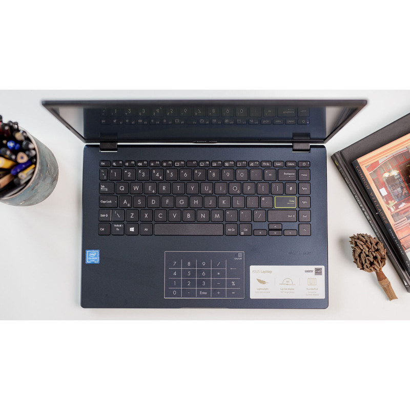 لپتاپ ایسوس مدل Vivobook Go 14 E410KA-CL464 با پردازنده Celeron N4500، رم DDR4 4GB، حافظه eMMC با ظرفیت 64GB، نمایشگر 14 اینچ TN با وضوح HD، دارای نامبرپد دیجیتال