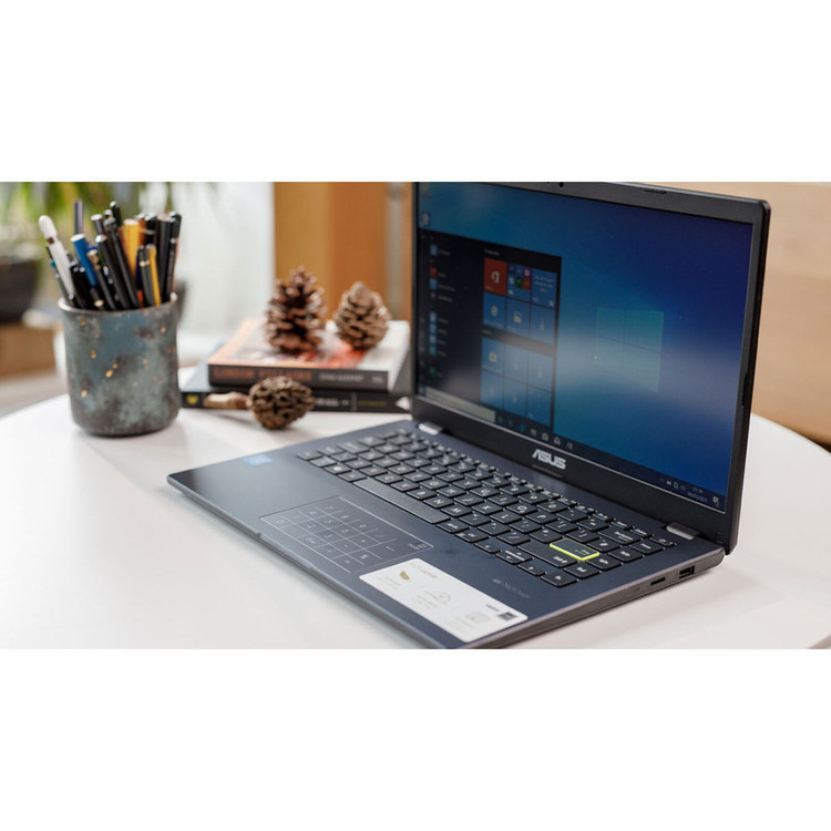 لپتاپ ایسوس مدل Vivobook Go 14 E410KA-CL464 با پردازنده Celeron N4500، رم DDR4 4GB، حافظه eMMC با ظرفیت 64GB، نمایشگر 14 اینچ TN با وضوح HD، دارای نامبرپد دیجیتال